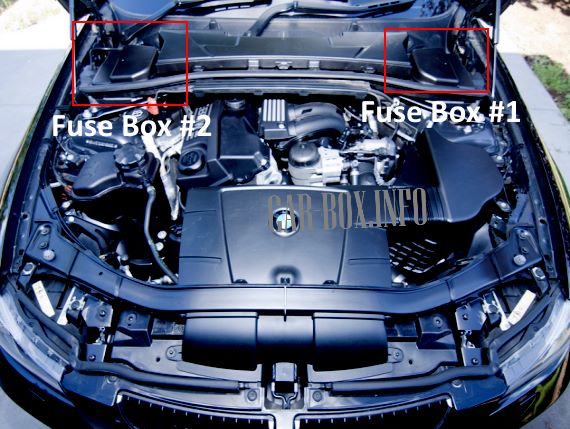 The location of the fuse boxes in the engine compartment of the car