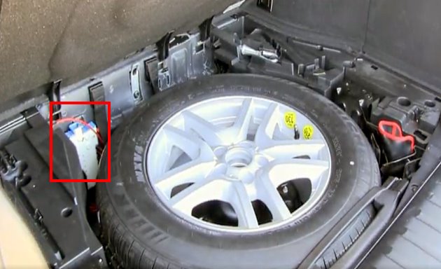 Location of the high-power fuse board in the luggage compartment of the car